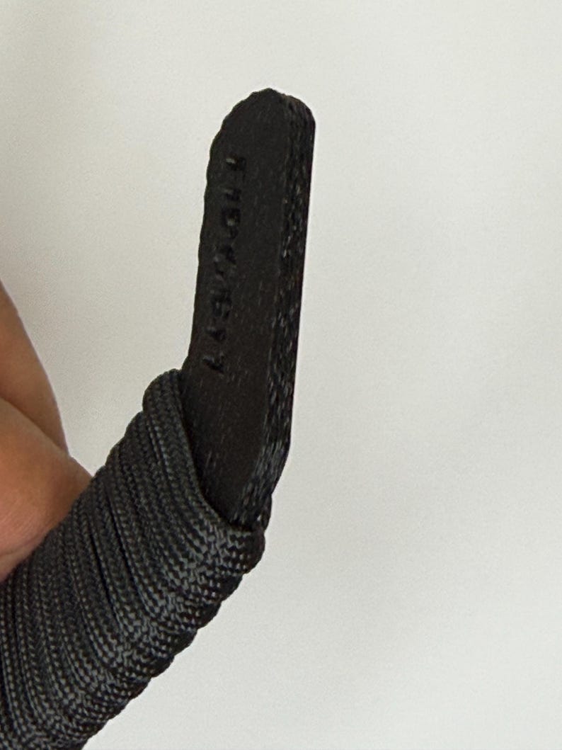 Fidgbit Black Textured in hand