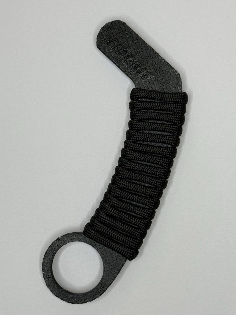 Fidgbit Black Textured, a handmade 3D printed paracord fidget toy